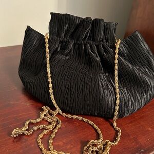 Pleated black bag with antique gold chain